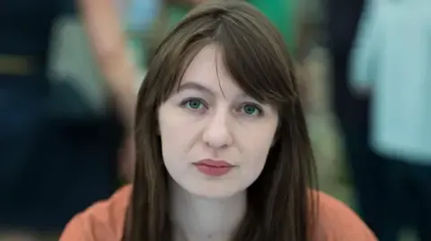 Sally Rooney claims she will not visit the UK over legal concerns