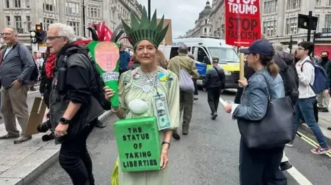 Numerous Demonstrators Gather in Heart of London to Denounce President Trump's Return Diplomatic Journey